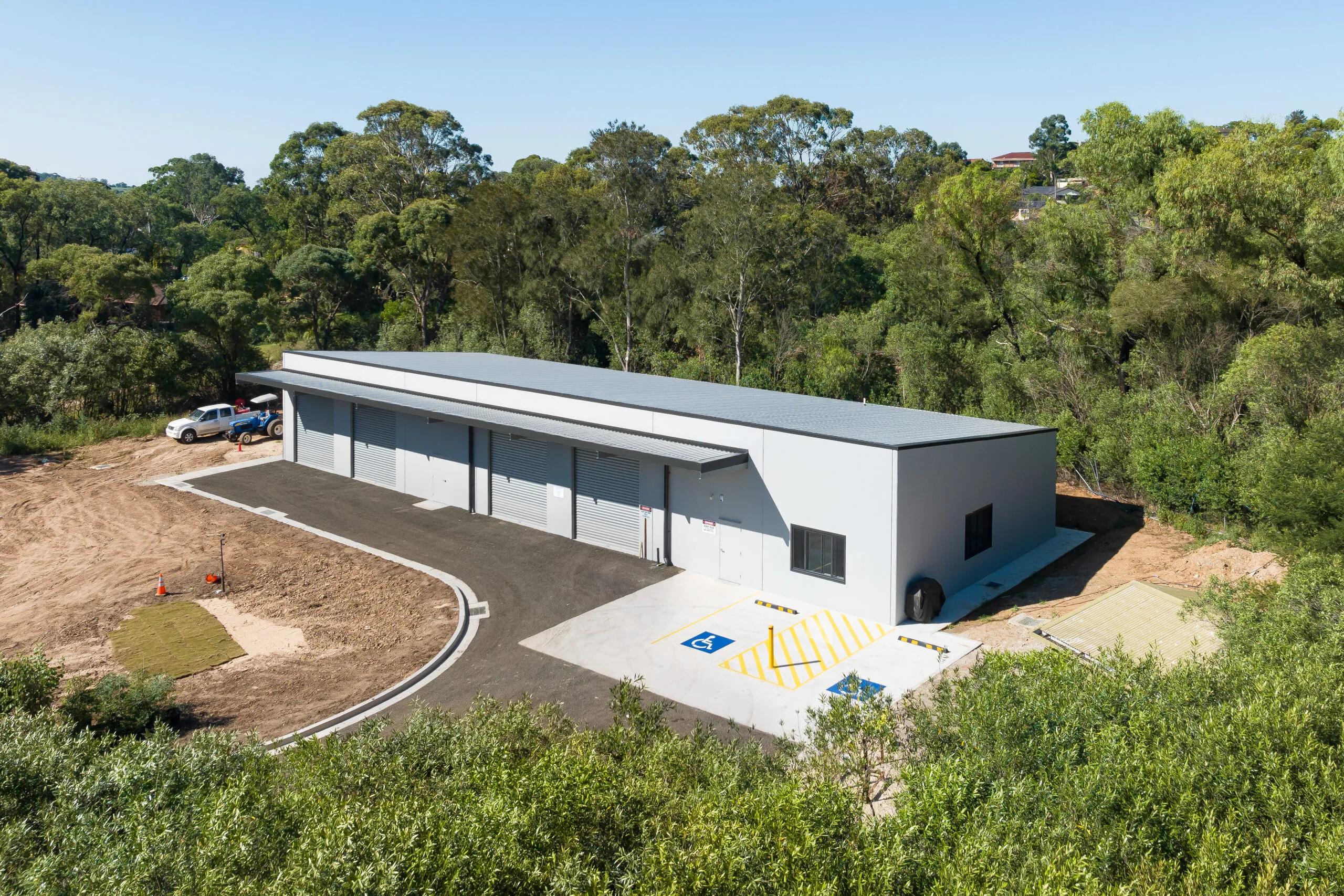 Completed Glen Alpine Golf Club amenities building beside bushland
