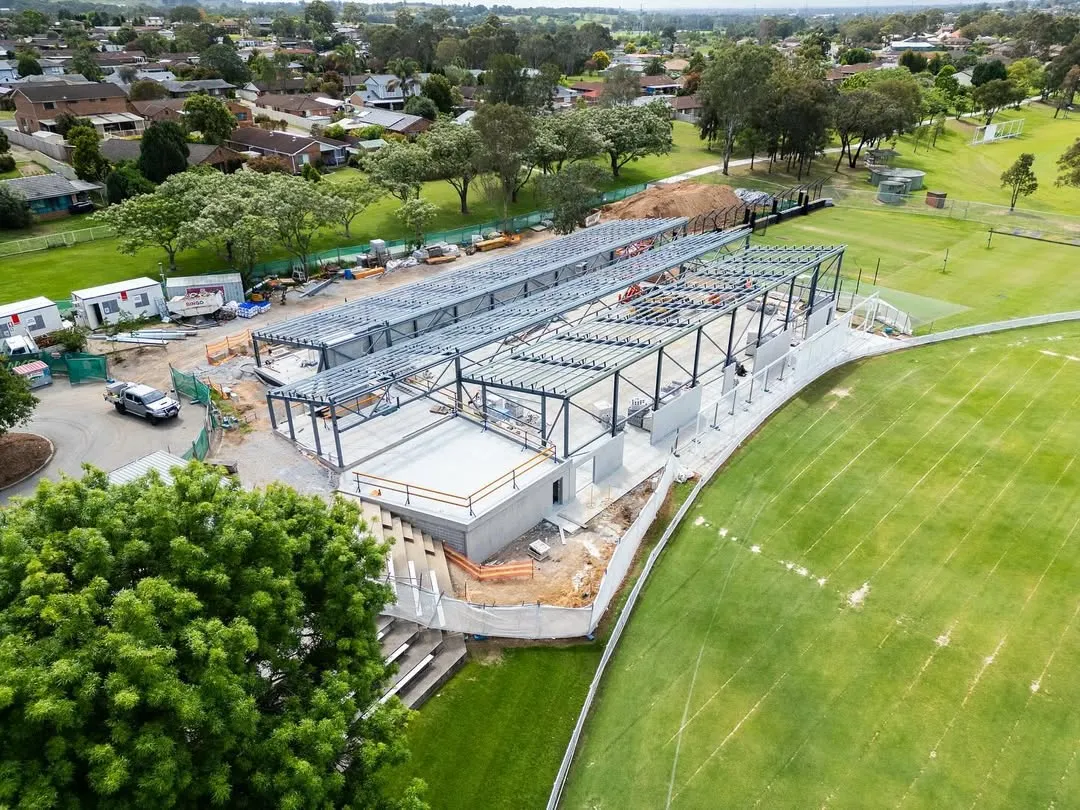 Aerial view of a steel-framed community building under construction