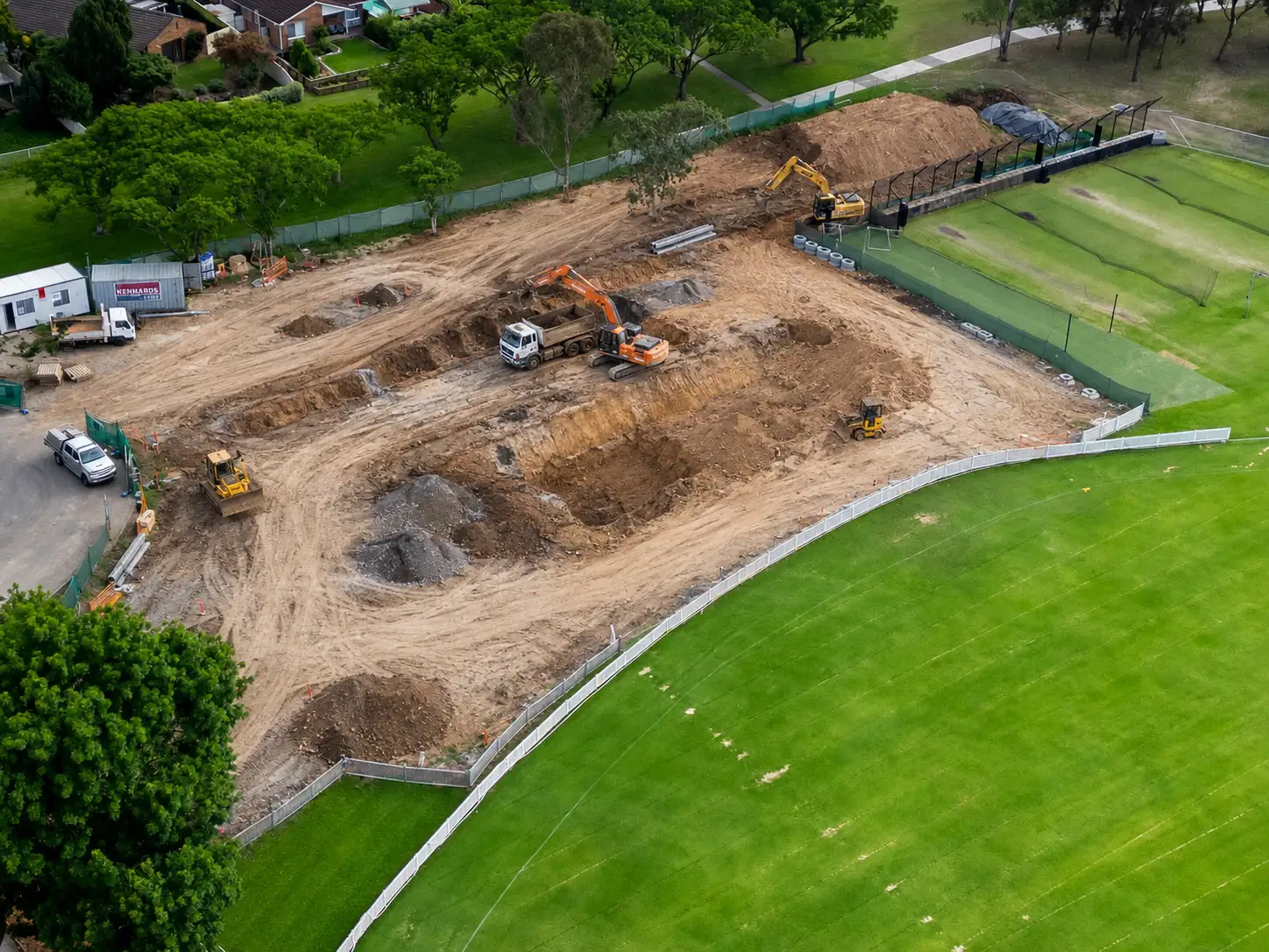 Aerial view of excavation works beside sporting fields